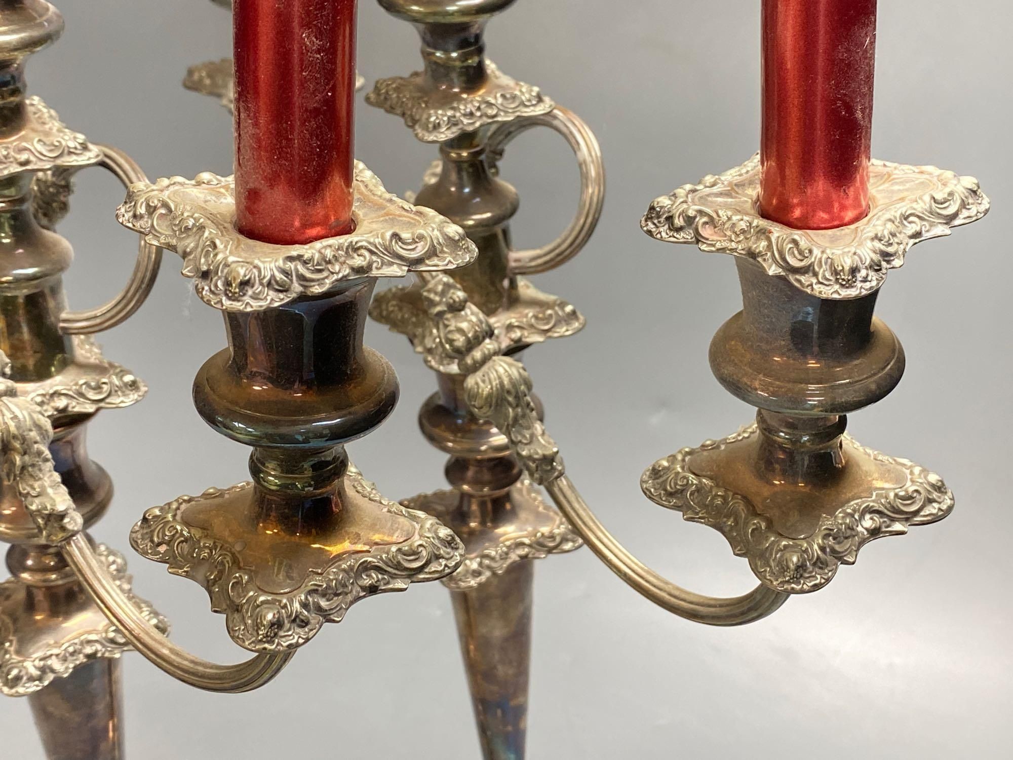 A pair of silver plated candelabra, three sconce candelabra, 51cm